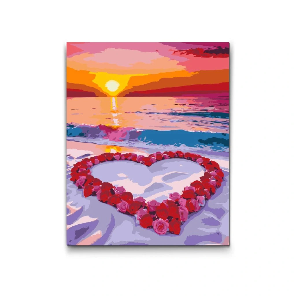 Måla efter nummer hjärta på stranden vid solnedgång